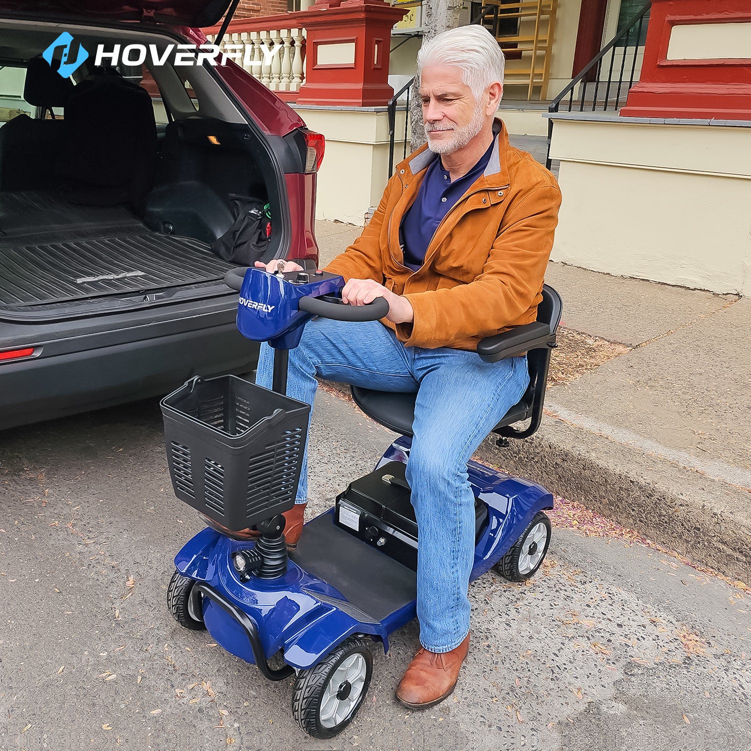 Elderly Gentleman Masterfully Navigates Blue Hoverfly T4 Scooter in Urban Jungle, Boasting Multifunctionality & Urban Comfort.