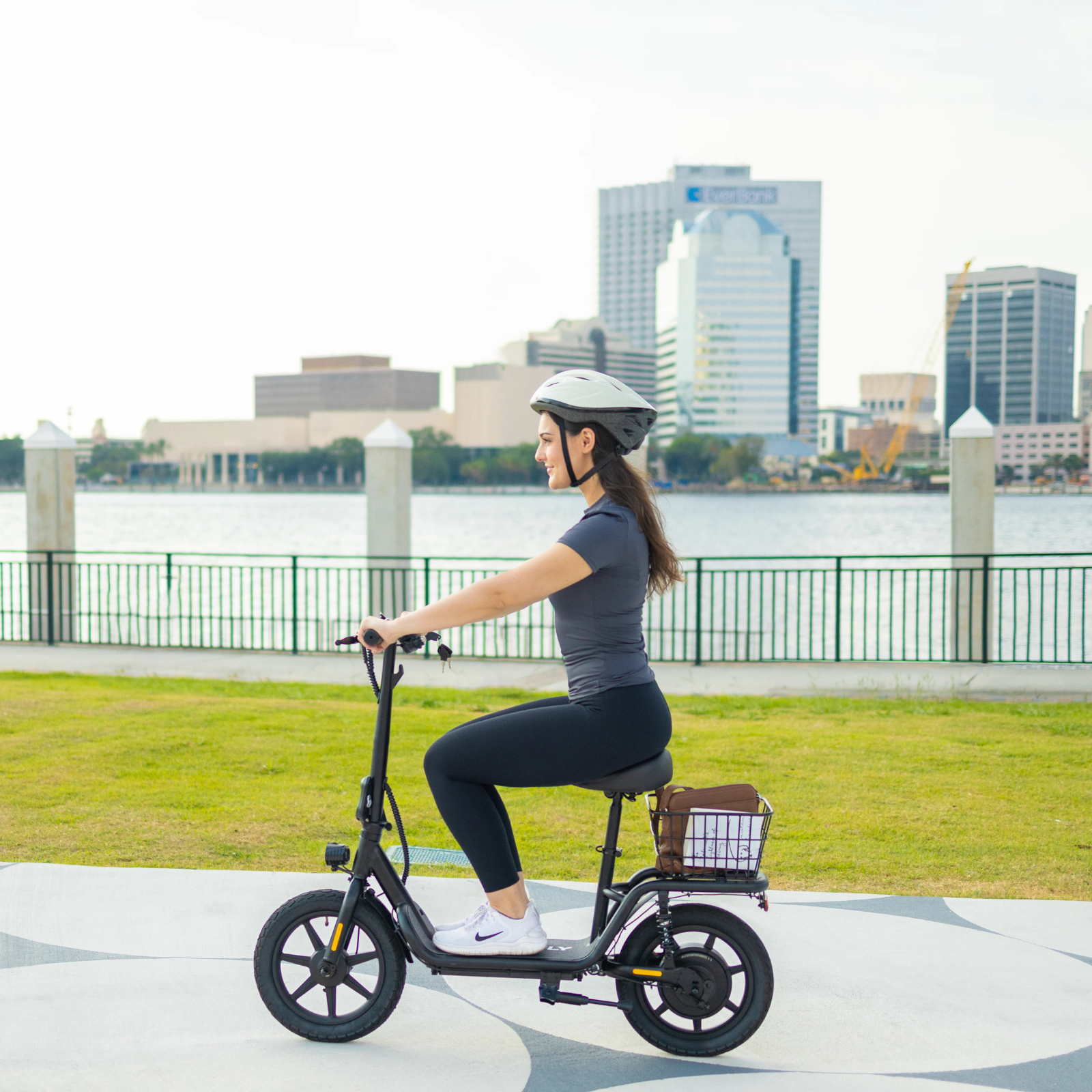 Girl commutes in the city on a Hoverfly-Z5 scooter