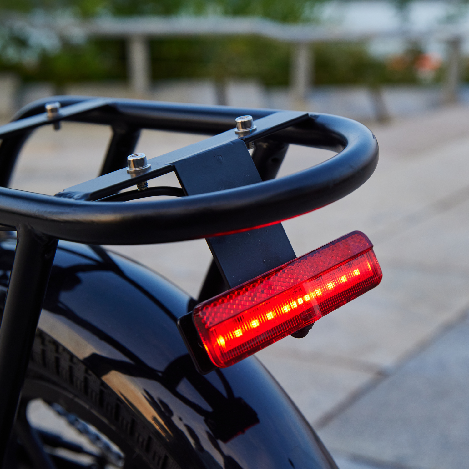 Red Tail Light on Back of Black Hoverfly H3 E-Bike, Showcasing Quality Craftsmanship & Boosting Safety.
